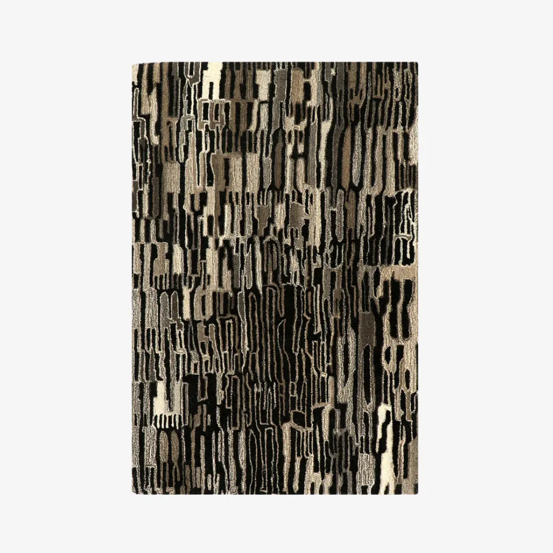 Neutral black desert area rug on wooden floor