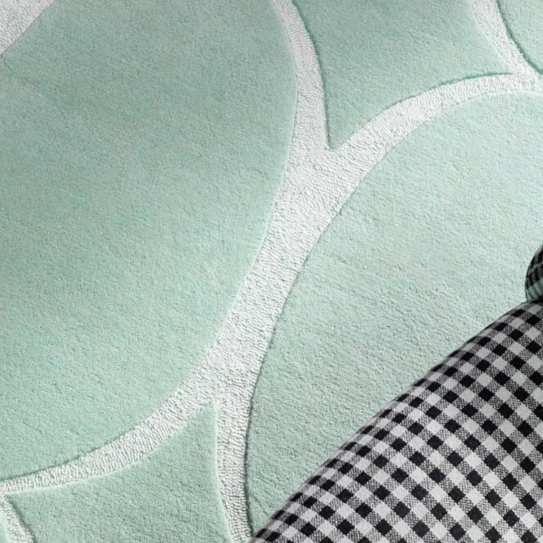 Mint green eclipse rug in a mid-century room