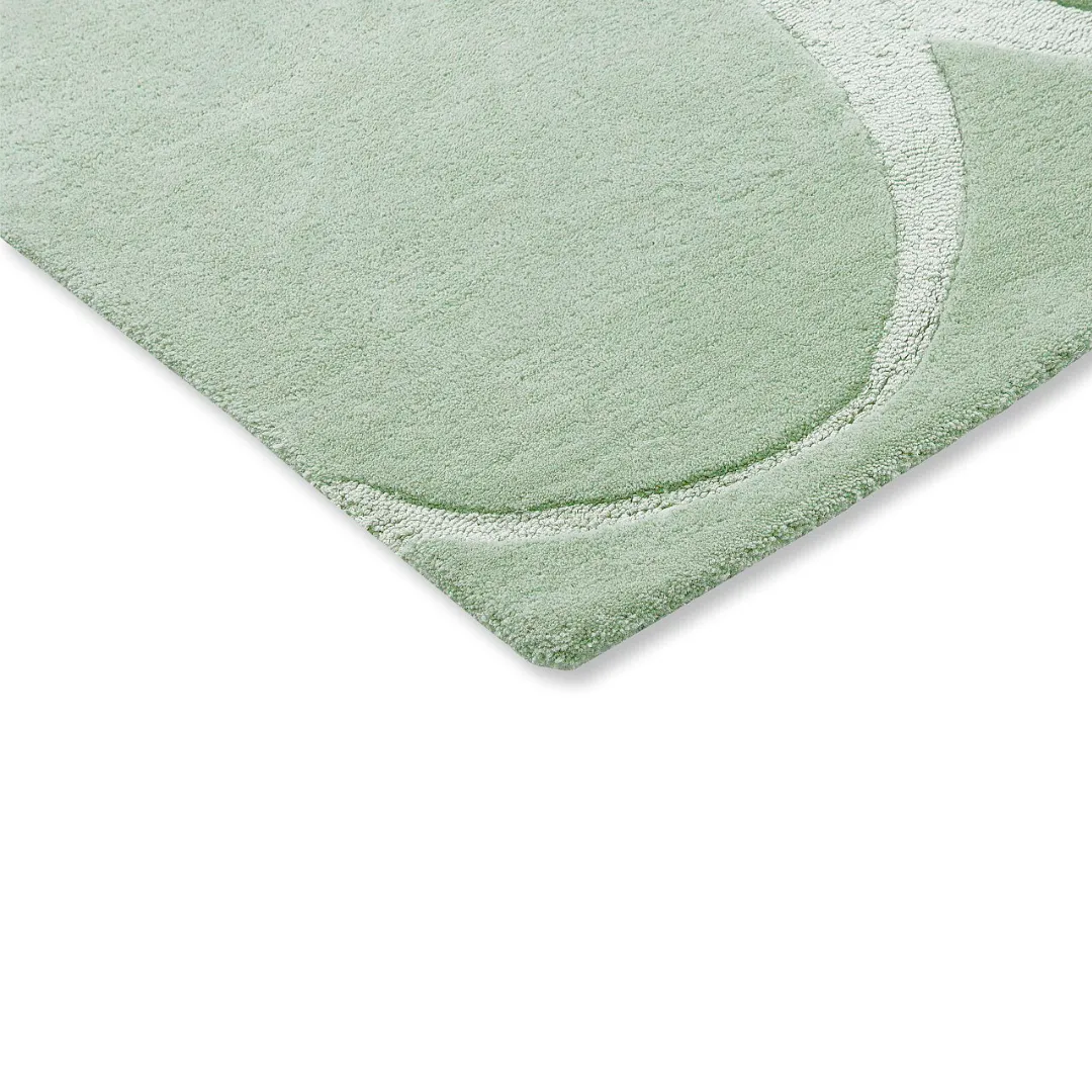 Geometric mint area rug with ivory accents