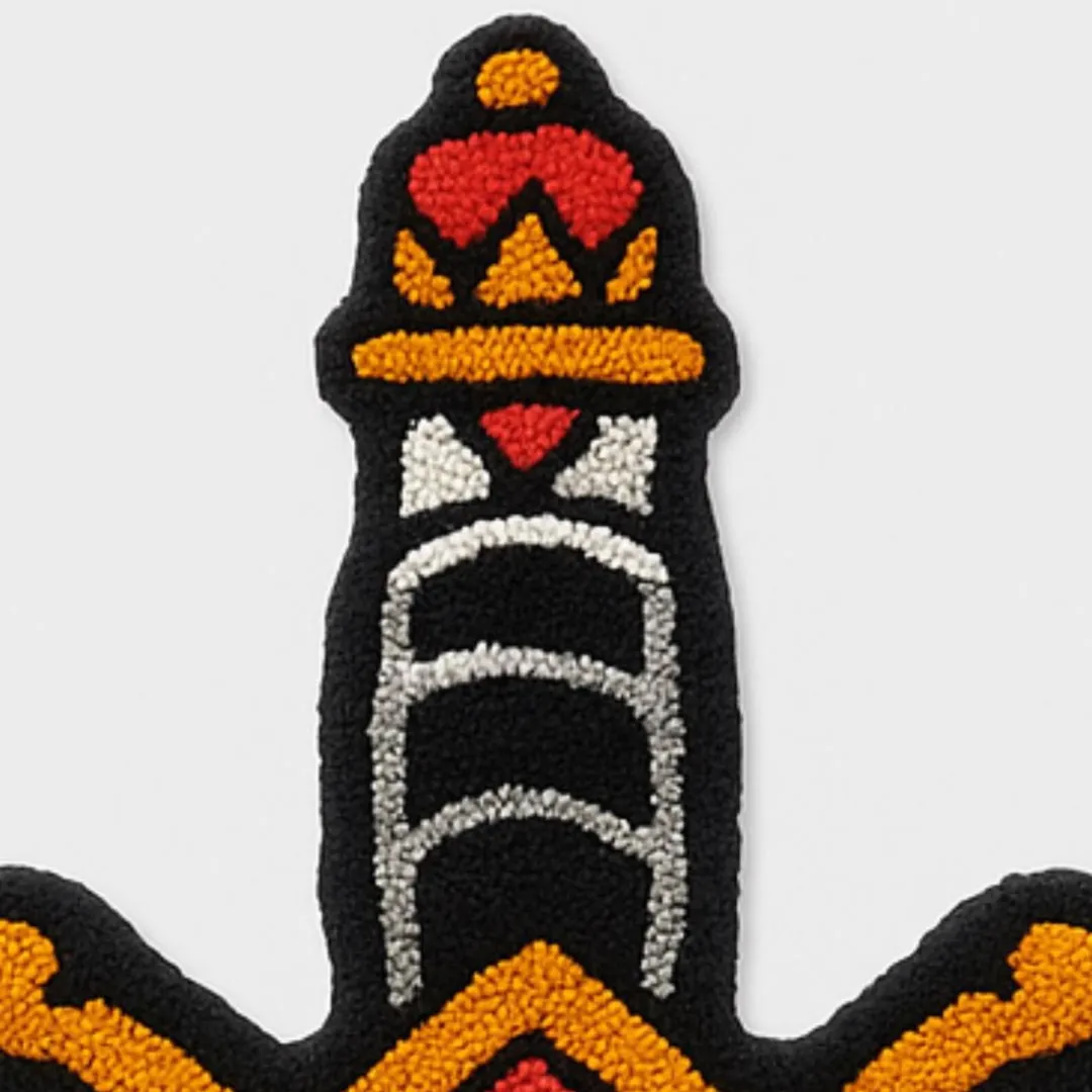 Hand-tufted rug with traditional tattoo-style panther and blade