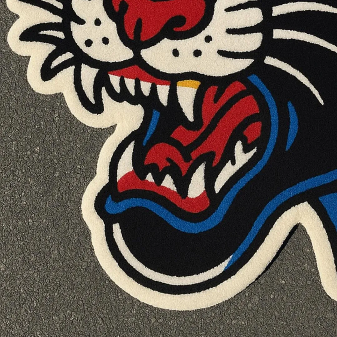 Tattoo-style panther face rug in black, red, and orange colors