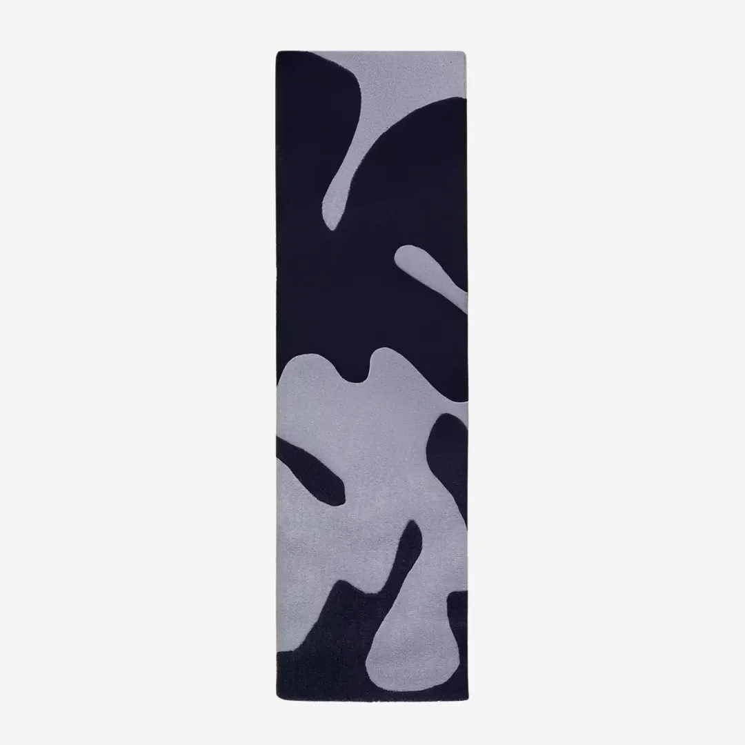 Shadow Camo Runner Rug with abstract black and gray camouflage design, styled for modern hallways