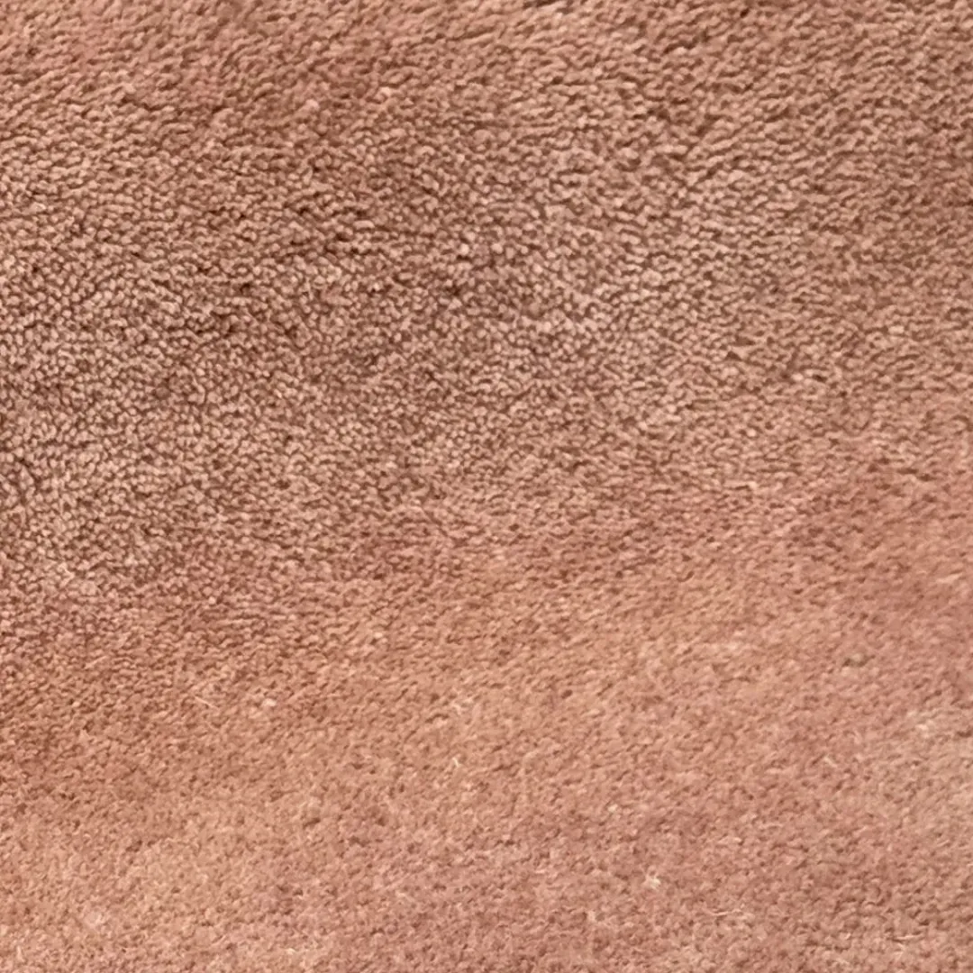 Wavy Orange runner rug with cloud-like edges and brown wave stripes on a burnt orange base