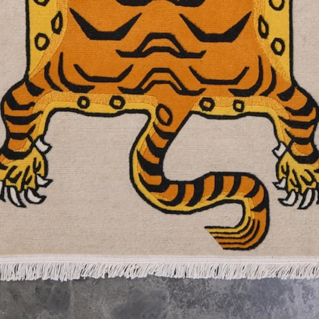 Orange tiger design rug with beige base and fringe