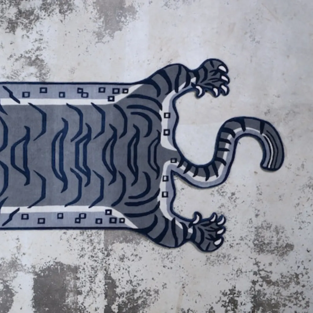 Black traditional tiger rug styled in a modern minimalist space