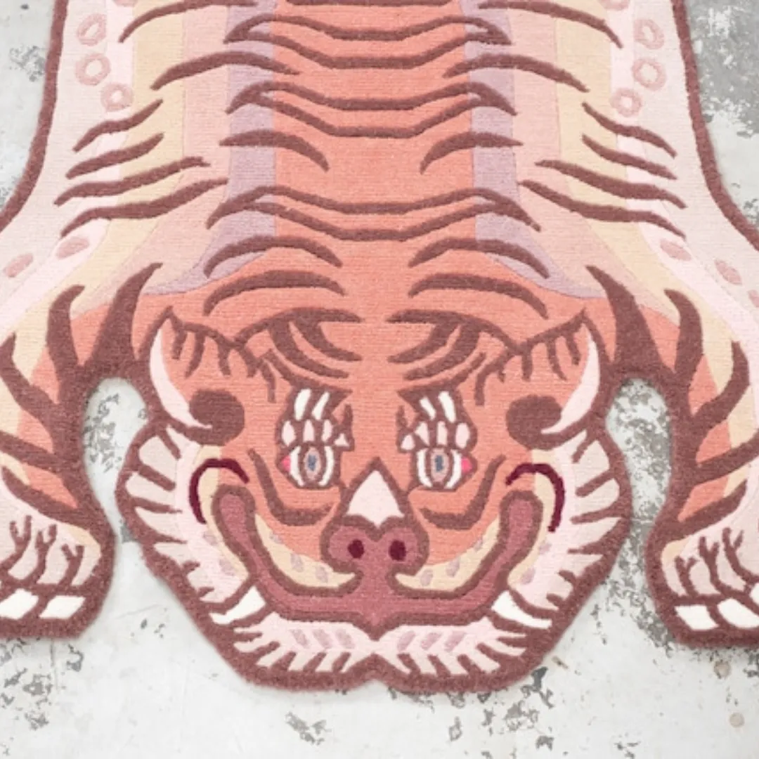 Pink striped tiger rug on concrete floor