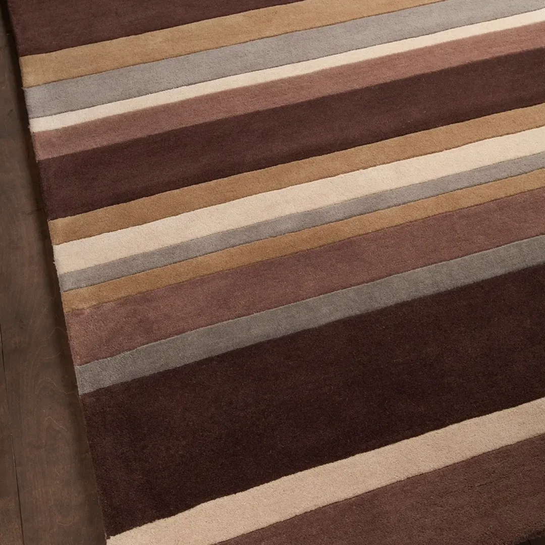 Modern striped design rug in brown, blue, and cream