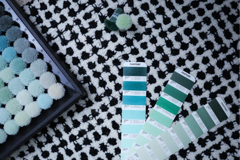 Custom-designed hand-tufted carpet with personalized artwork displayed in modern interior – create your own custom rug with Sneagear