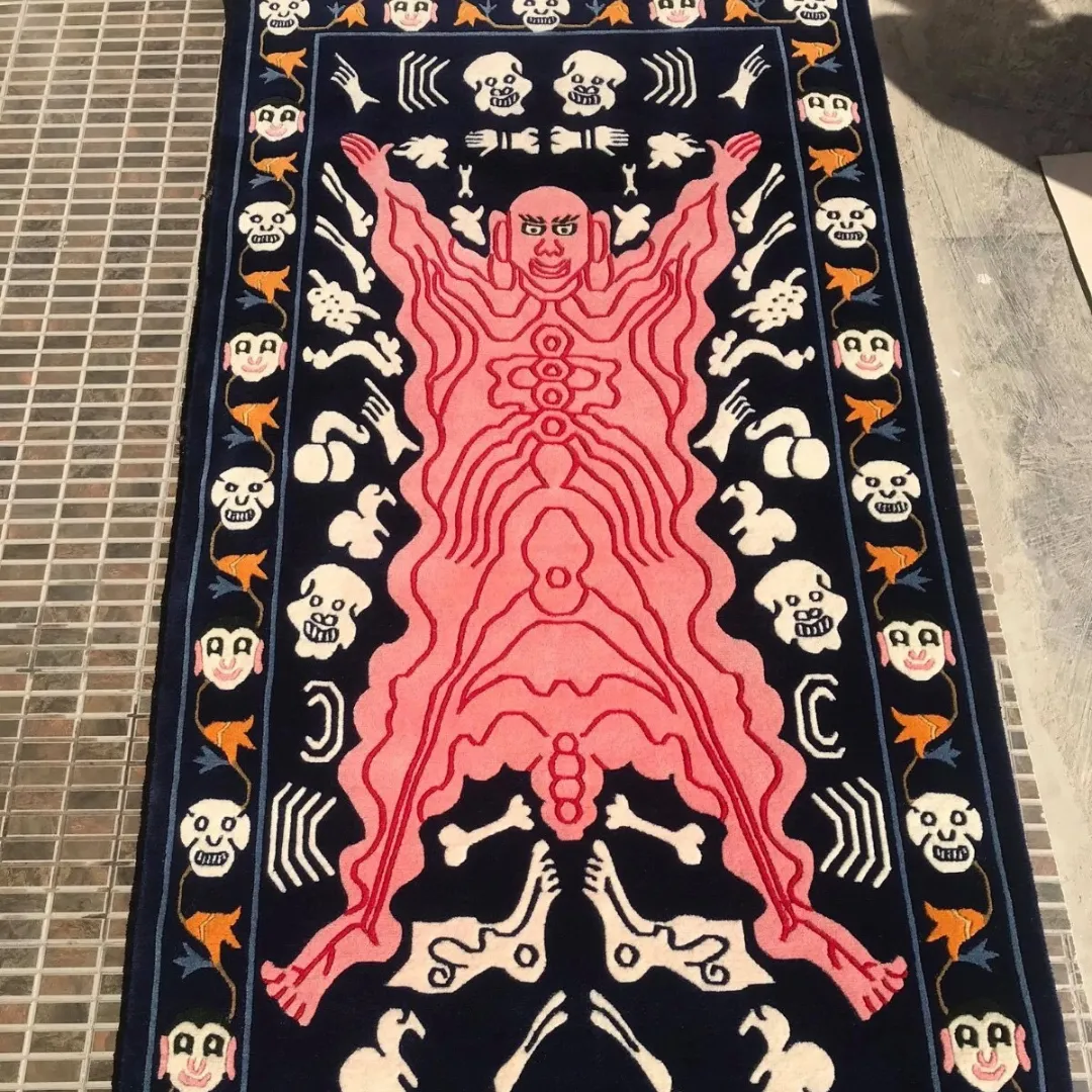 Demon tattoo rug with pink humanoid figure and skull motifs on navy background