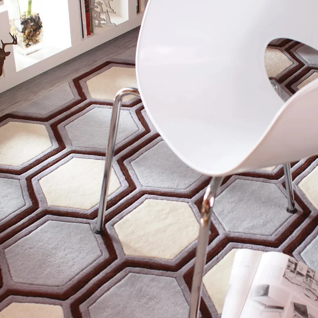 Honeycomb design rug in blue, white, and dark brown