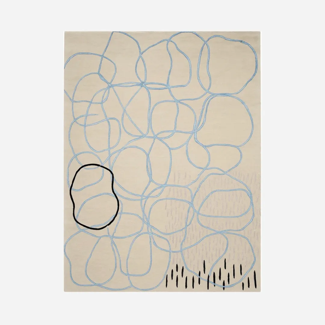 Hand tufted wool rug with abstract blue and black sketch loops