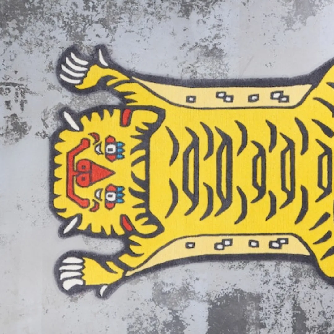 Close-up of hand-tufted wool surface on yellow tiger rug