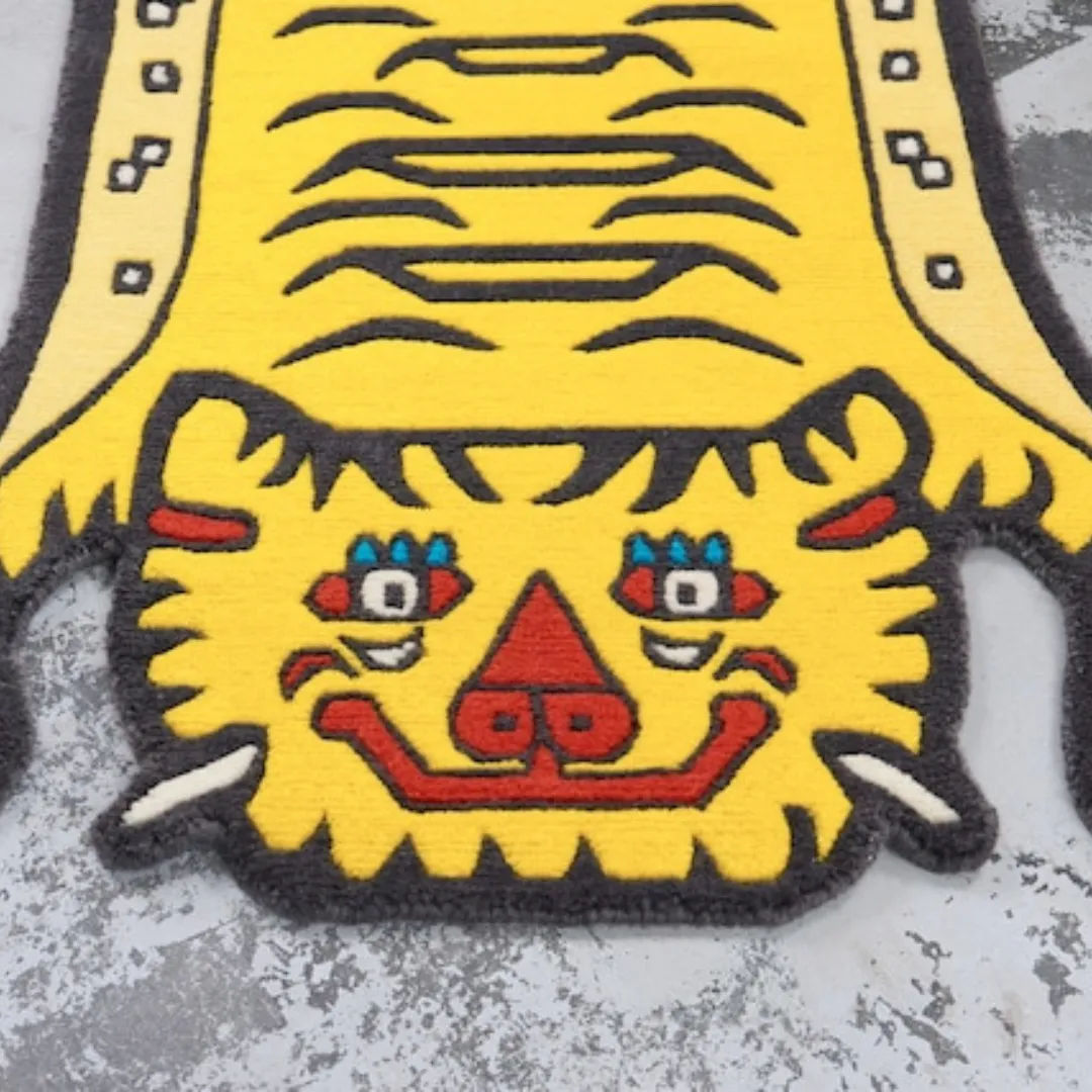 Yellow tiger rug in Tibetan-inspired shape with bold stripes