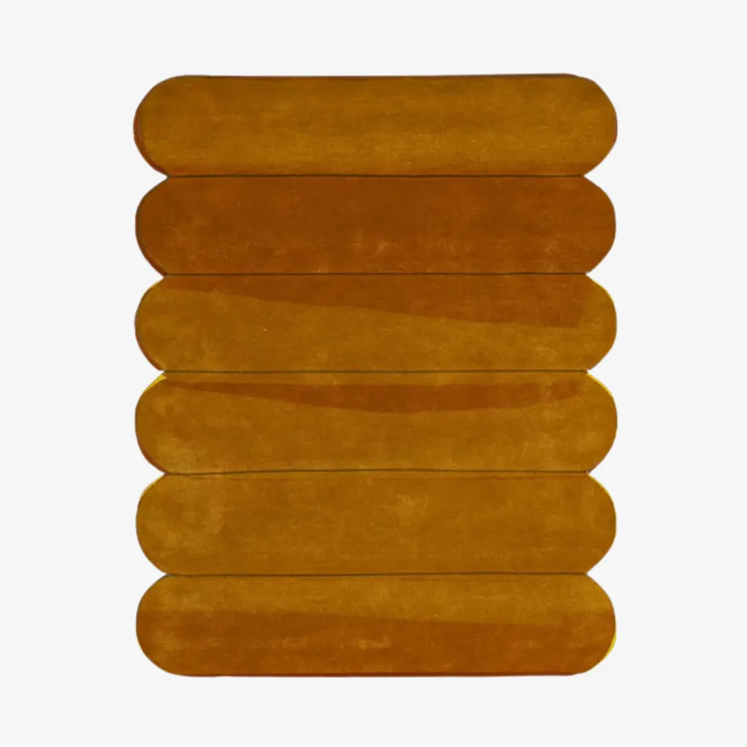 Amber Layers Rug with stacked velvet pieces in rich amber tones.