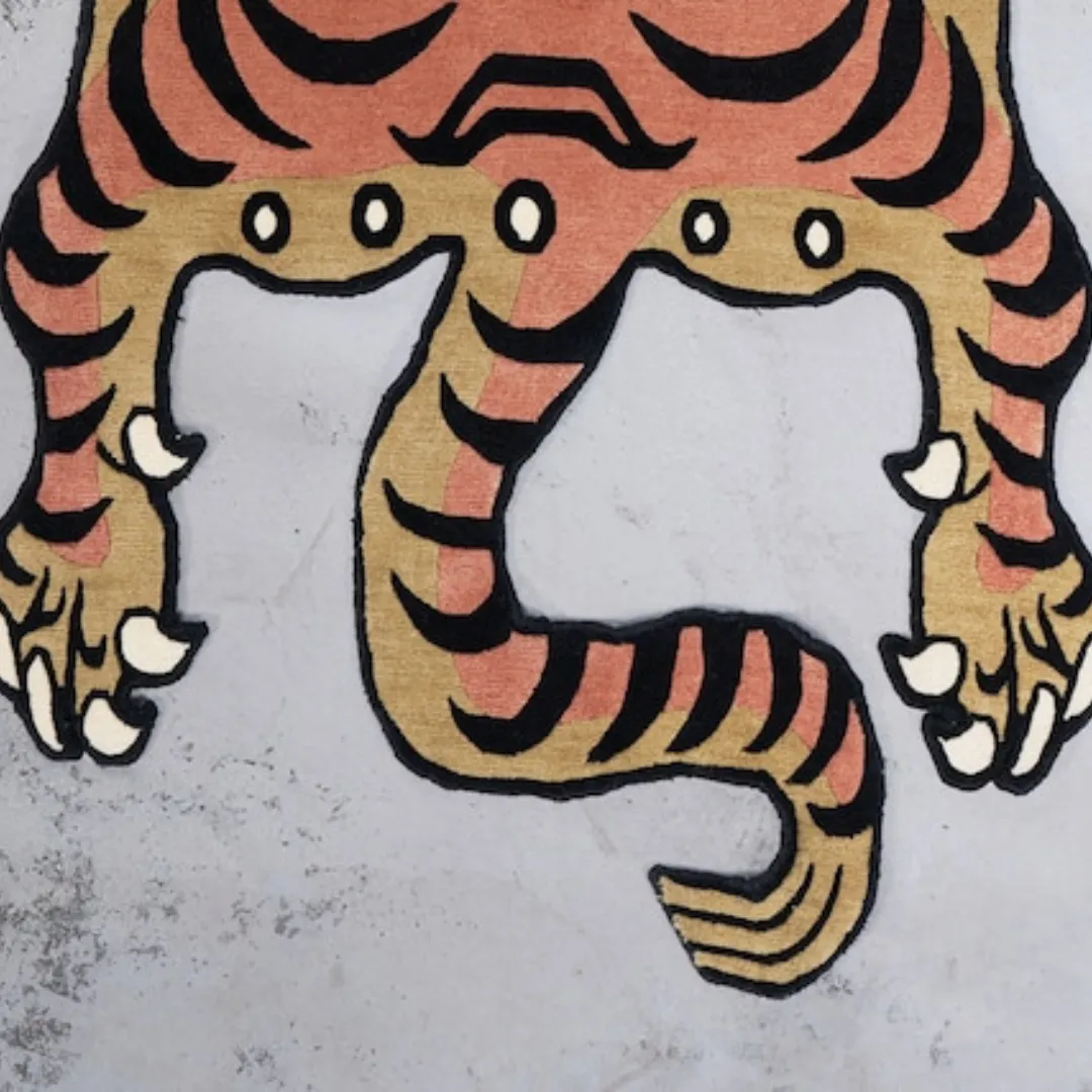 Unique and fierce tiger-inspired rug in rich browns, blacks, and oranges
