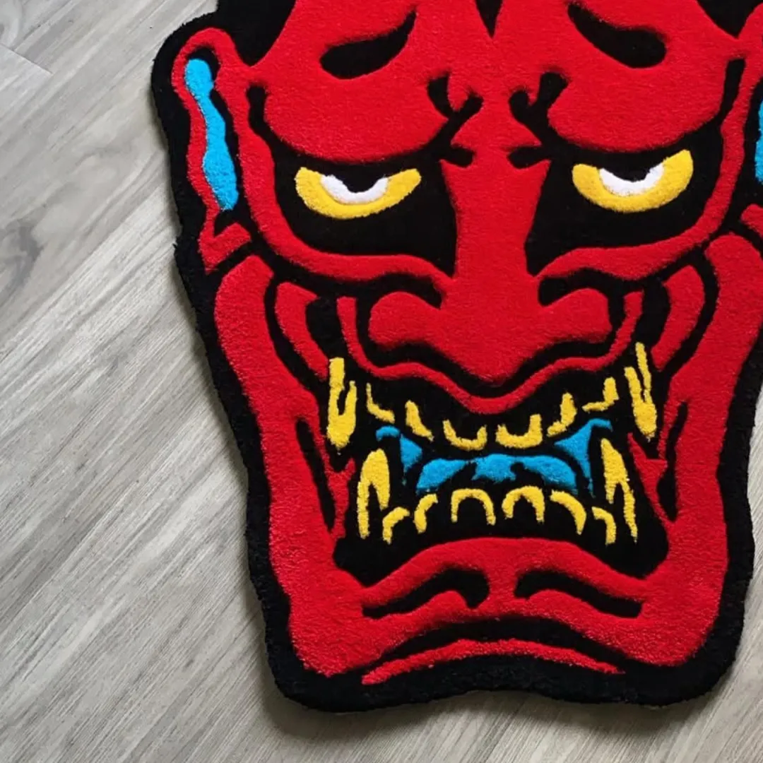 Emberheart Rug Emberheart Ink Rug featuring fierce red demon face with yellow horns and blue accents – handmade tufted rug by Sneagear