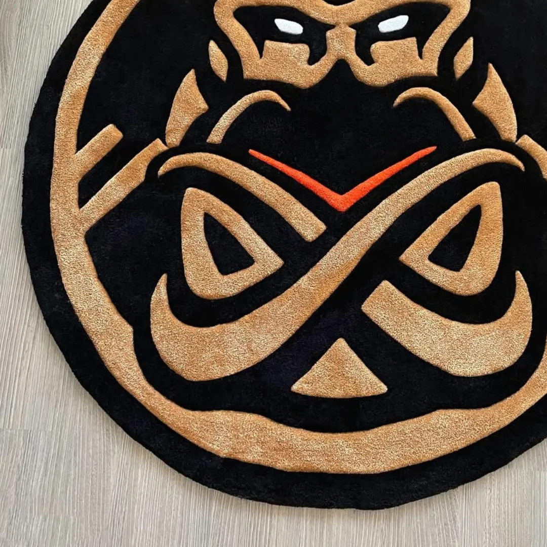 Obsidian Rug Round Obsidian Crest Rug with modern geometric art and gold detailing on black base