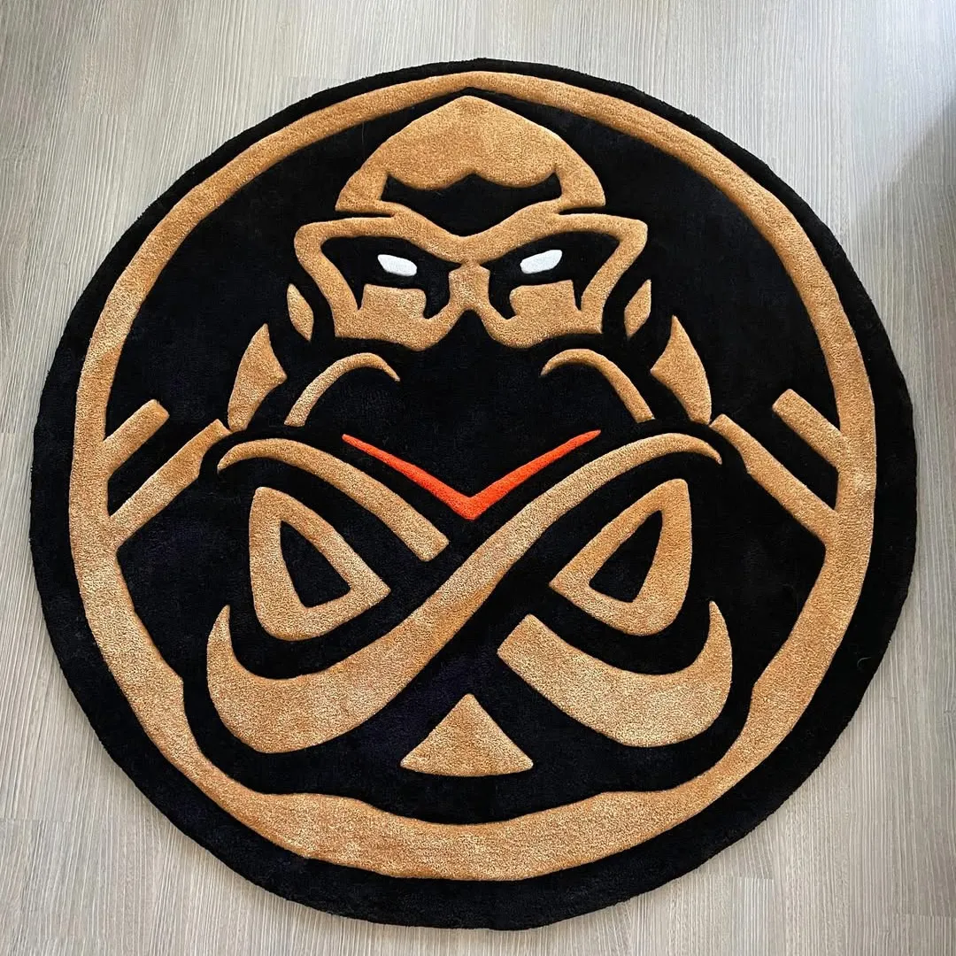 Obsidian Vortex Rug Obsidian Crest Rug featuring bold black and gold circular design with abstract face motif – handmade tufted rug by Sneagear