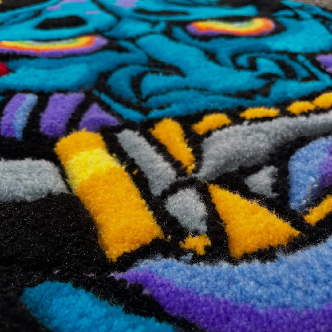 Oni Surge Inked Rug Bold blue demon rug with rainbow eyes and blade motif – Oni Surge Rug for modern interiors