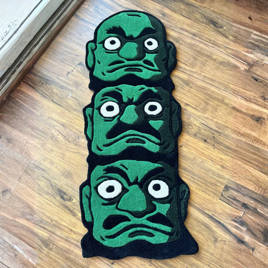 Oni Trinity Inked Rug Bold Oni Trinity Rug with triple-face demon design in green and black tones – handmade tufted wool rug