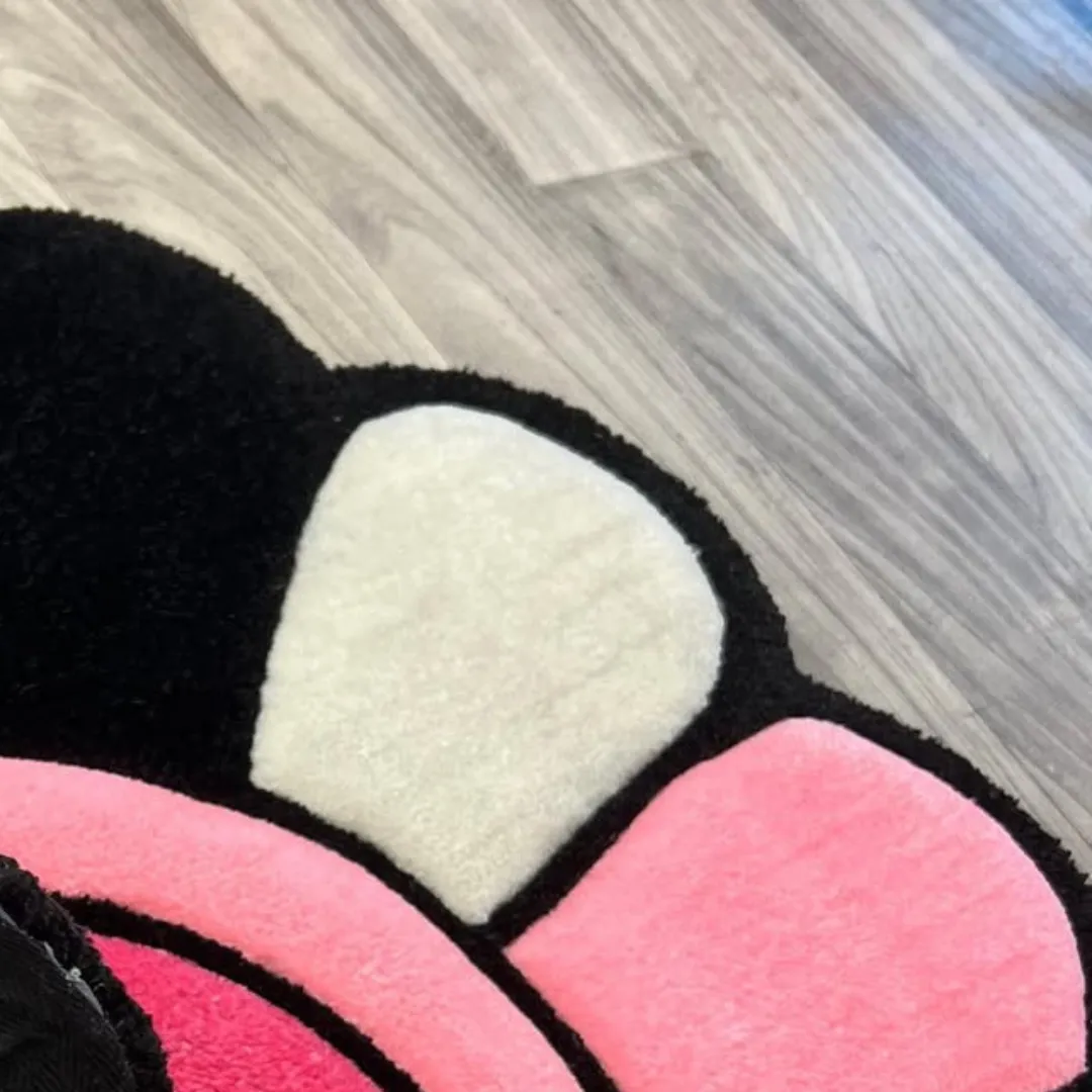 Petal Takashi Rug Handmade Petal Pop Rug with bright pink center and multicolor petals, perfect for adding fun and contrast to modern spaces.