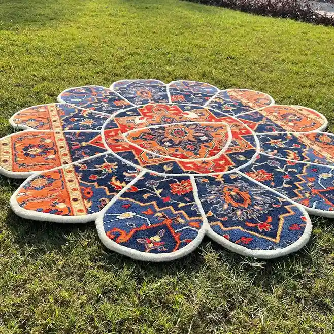 Regal Bloom Takashi Murakami Rug Persian-style Regal Bloom Rug in deep blue and burnt orange hues, hand-tufted in a flower shape for unique artistic decor.