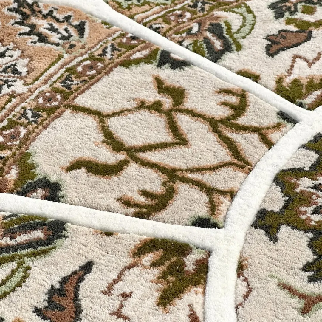 Whisper Takashi Rug Close-up of the Whisper Bloom Rug’s hand-tufted wool texture, showcasing intricate Persian detailing in neutral beige and soft brown hues.