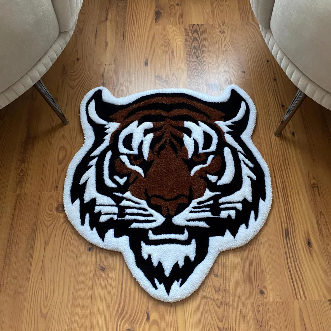 Wild Ember Rug Hand-tufted Wild Ember Rug featuring bold tiger face design in brown, black, and white tones