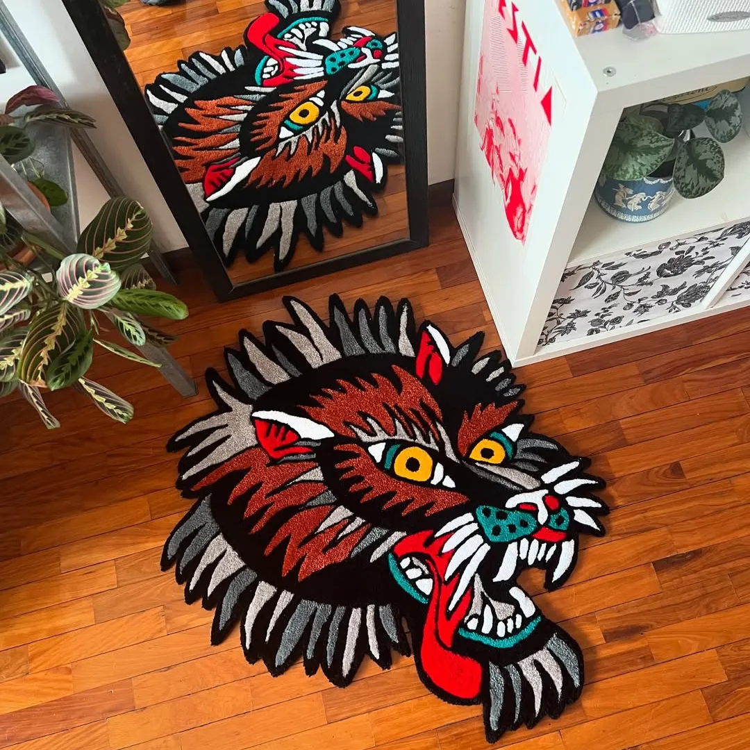 Wild Howl Rug Wild Howl Rug featuring fierce wolf face design with red tongue and yellow eyes – hand-tufted rug by Sneagear