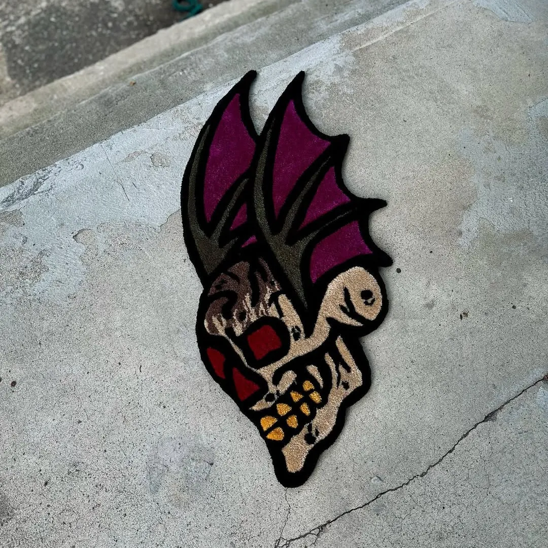 Crimson Rug Tattoo-style rug with crimson-eyed skull and purple bat wings – Crimson Mirage Rug