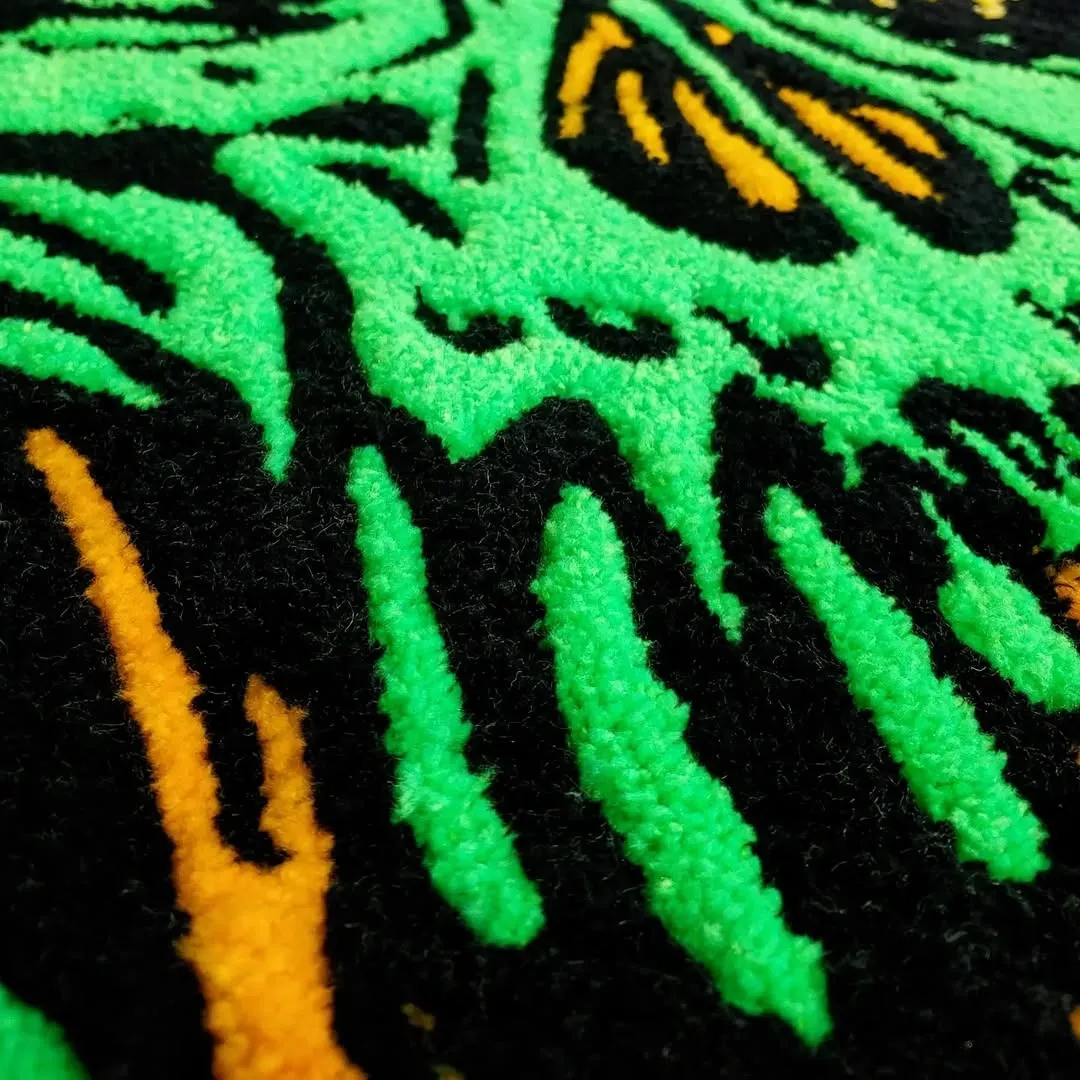 Neon Rot Inked Rug Handmade Neon Rot Rug with glowing green skull design and orange detailing – gothic statement rug