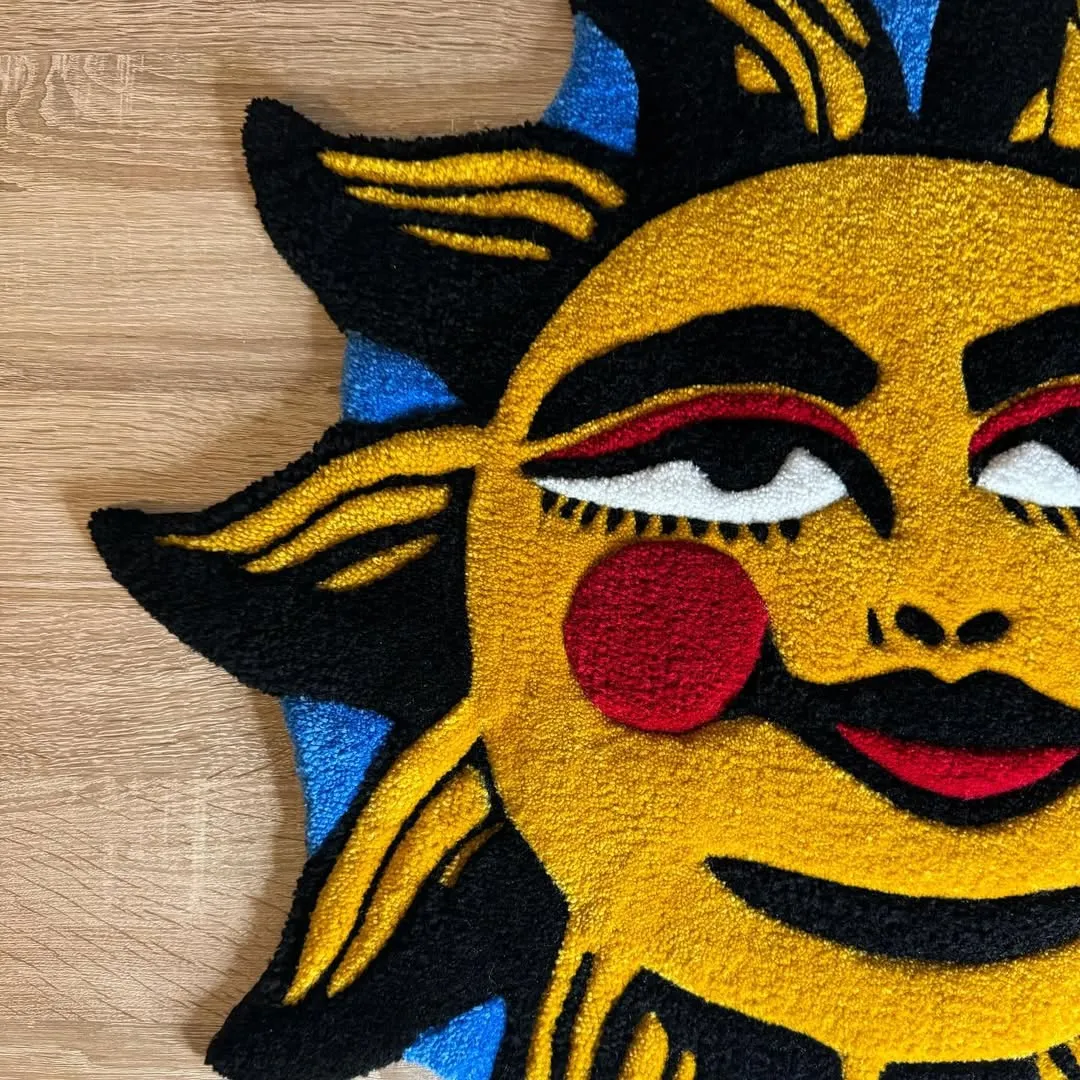 Solar Smile Inked Rug Tattoo-style rug with smiling sun motif in yellow, red, and black – Solar Smile Rug