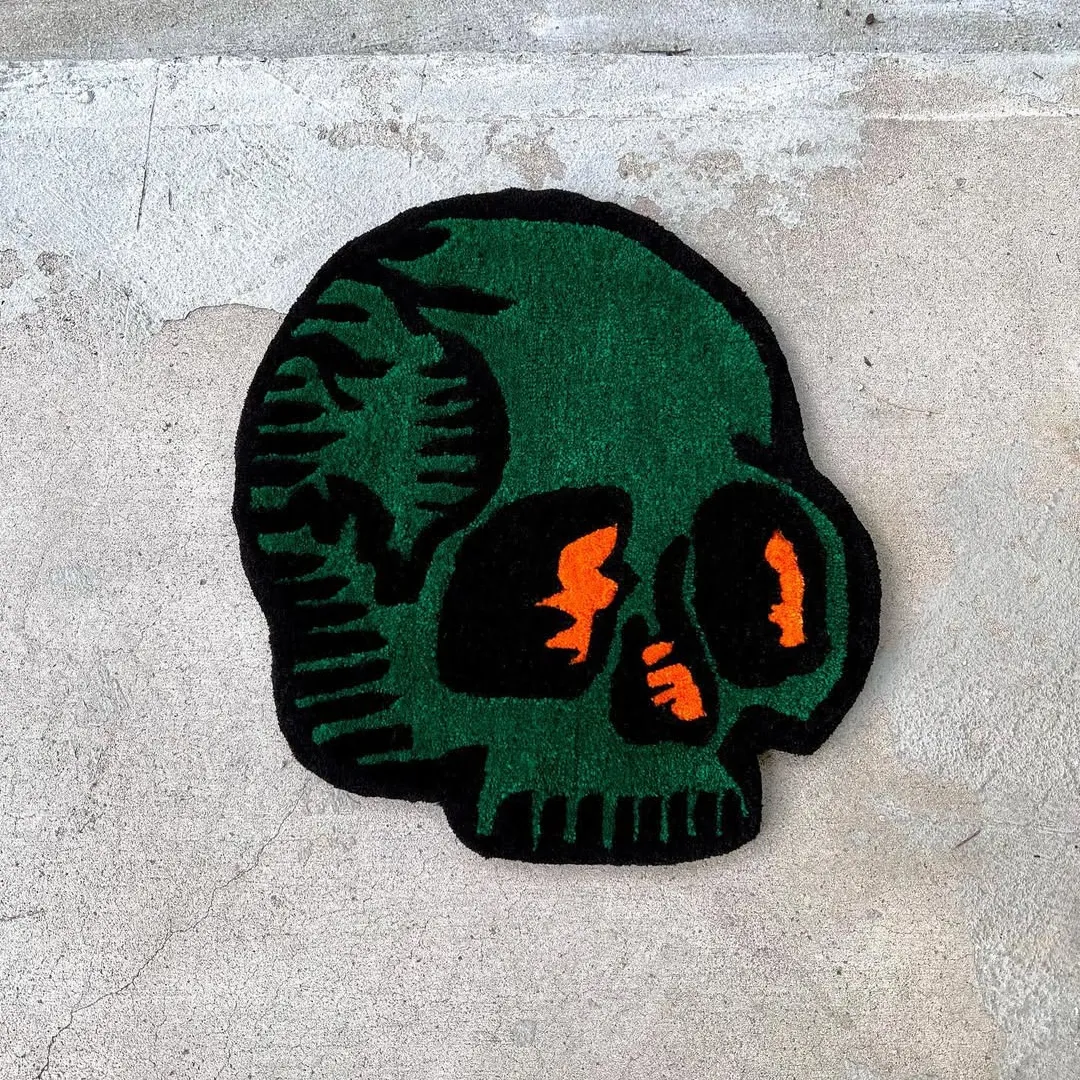 Verdant Skull Rug Verdant Skull Rug featuring green skull design with orange accents – handmade tattoo rug by Sneagear