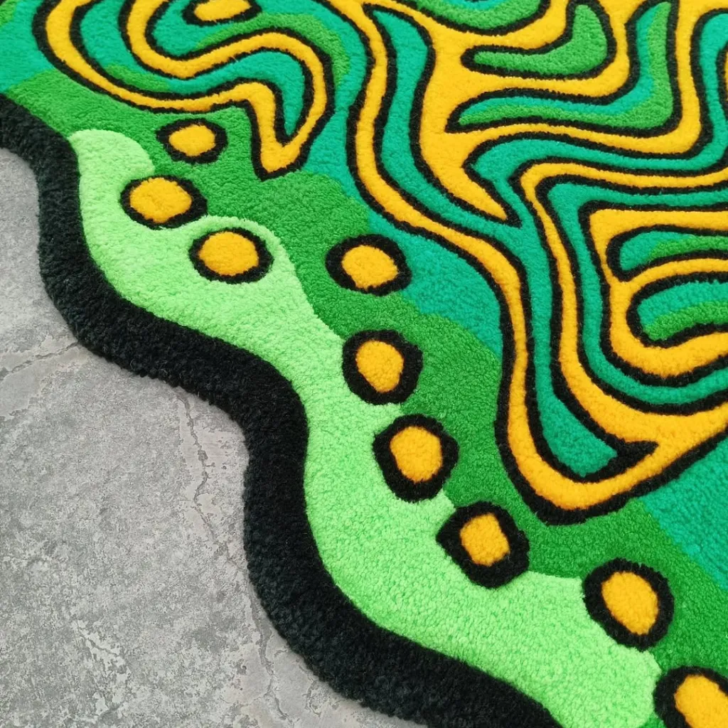 Moss Claw Hand Tufted Wool Rug Texture Edge Close up angle of the Moss Claw rug edge showing the plush hand tufted wool texture and die cut shape.