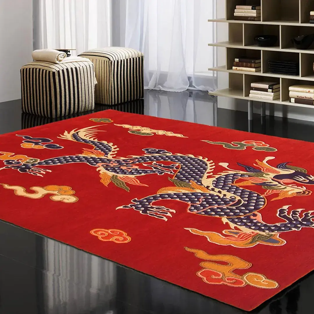 imperial flame red tibetan dragon rug living room Angled view of the Imperial Flame rug placed on a dark polished floor in a modern living space, featuring a vibrant red wool background with a large, intricate blue Tibetan dragon and cloud motifs.