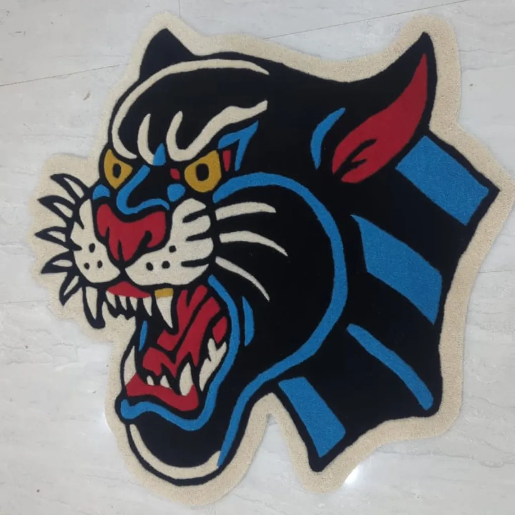 night howler inked panther head shaped rug Top down view of the Night Howler Inked Rug, highlighting the custom die-cut shape and the classic "American Traditional" tattoo aesthetic of the snarling panther.