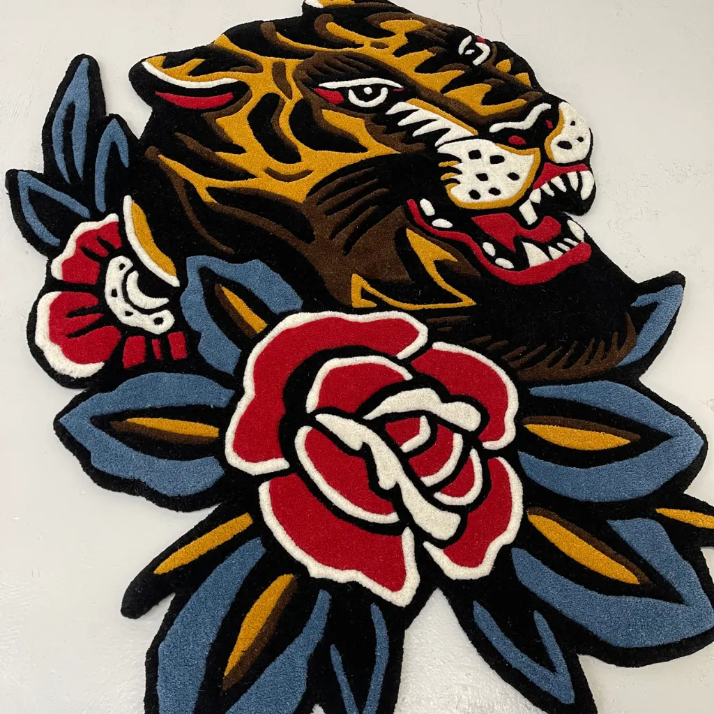 Old School Tiger Head And Rose Rug Top down flat lay view of the Bert Grimm Tiger Traditional rug featuring a custom die cut shape of a tiger profile and floral motif isolated on a white background.