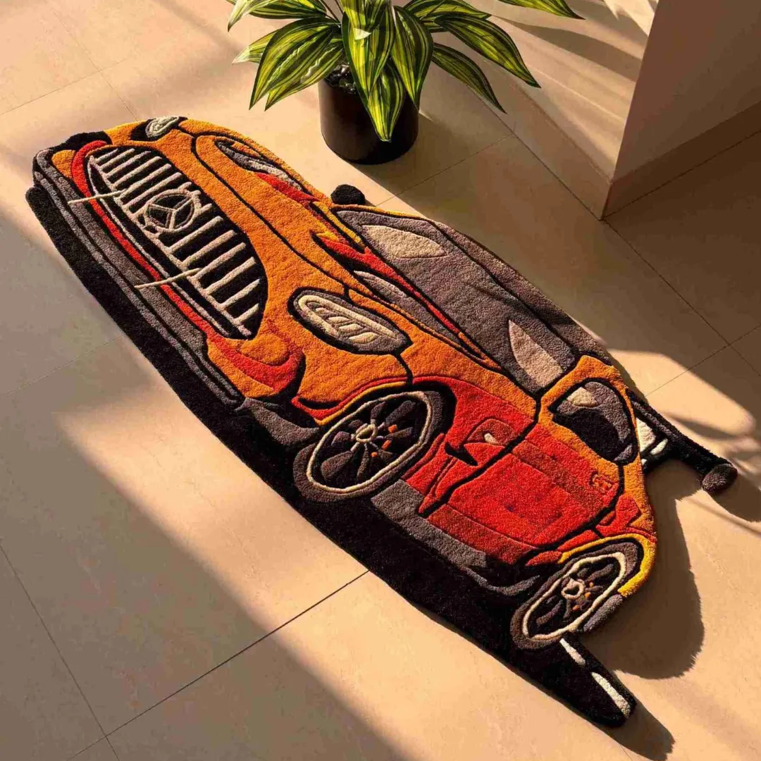 racing gold rug automotive floor decor Close-up angled view of the Racing Gold rug, highlighting the plush wool texture of the front grille, headlights, and aerodynamic hood vents.