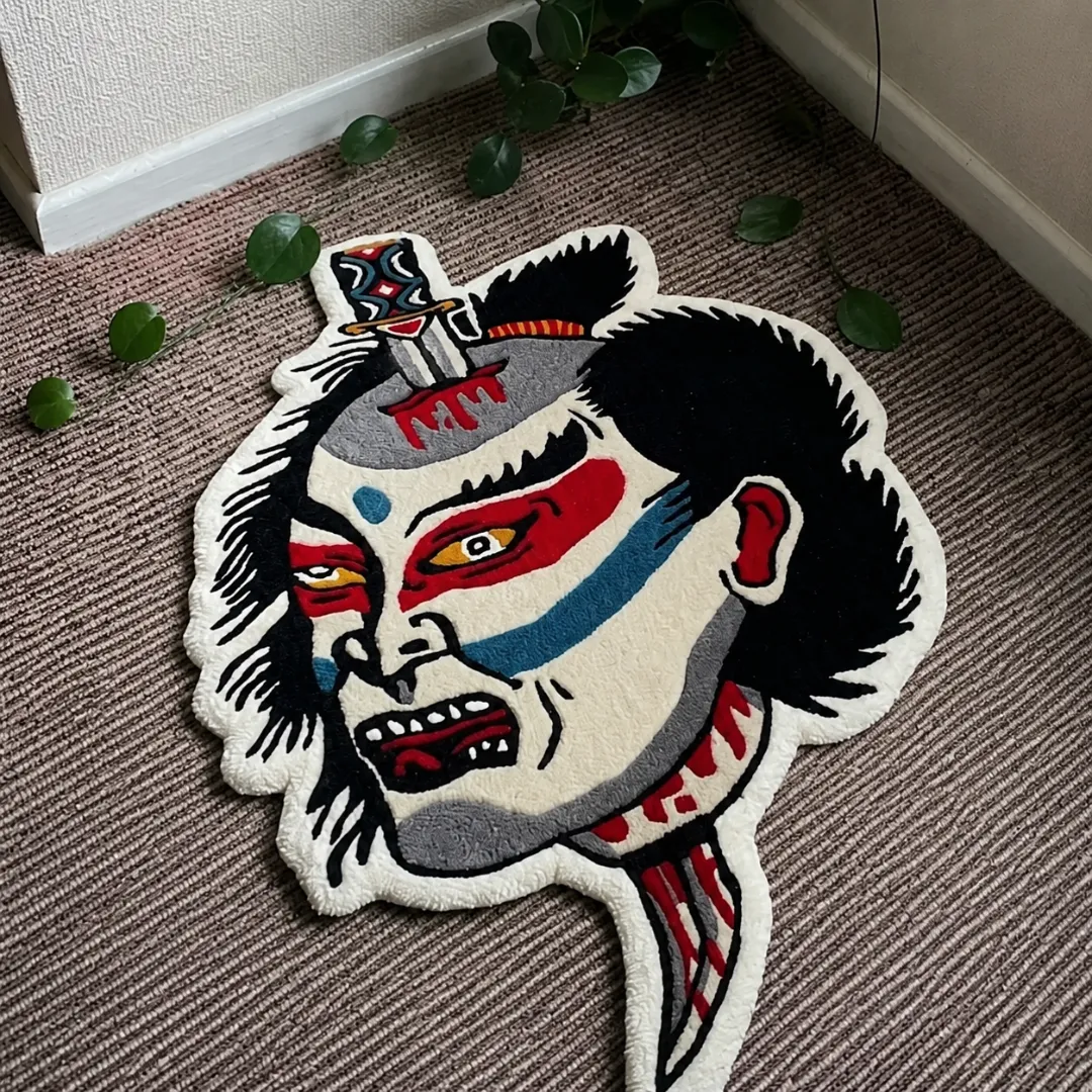Angle view of the handmade Namakubi Design tufted rug showcasing its unique organic contours and bold Japanese tattoo art on a carpeted floor.