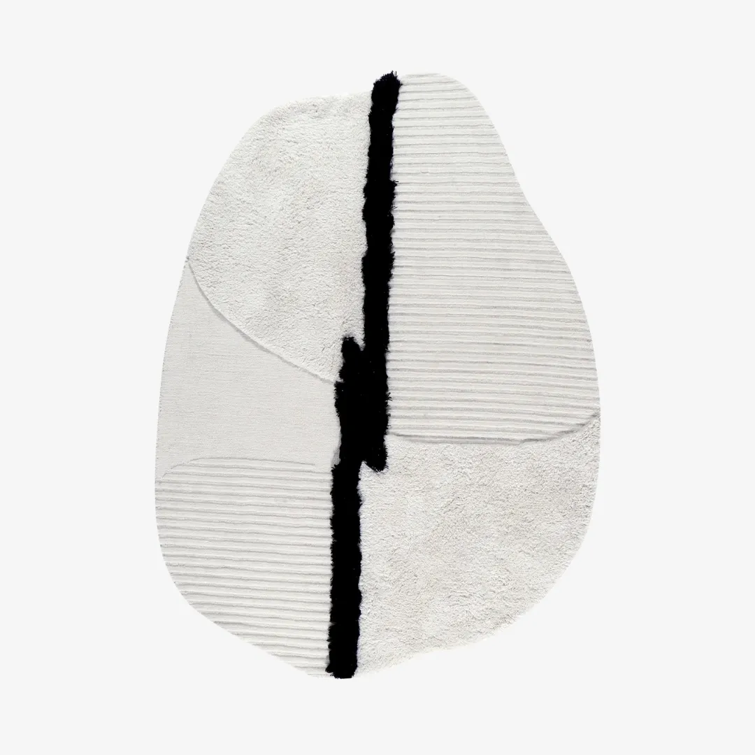 Modern sculptural rug with mixed pile textures in black and white