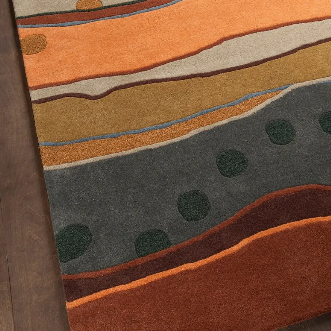 Wavy lines and bold dots in brown, orange, and green rug