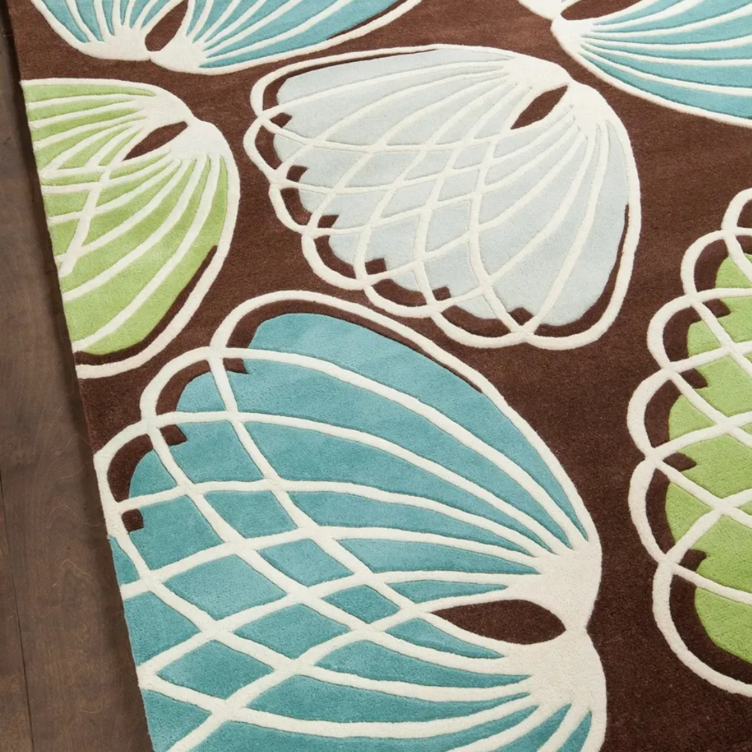 Nature-inspired rug with leaf patterns in blue and green