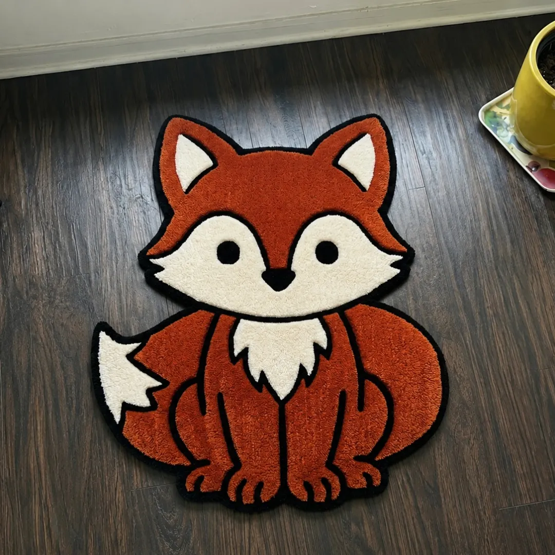chaos frenzy rug top view Chaos Frenzy fox shaped tufted area rug displayed flat on a dark wooden floor.