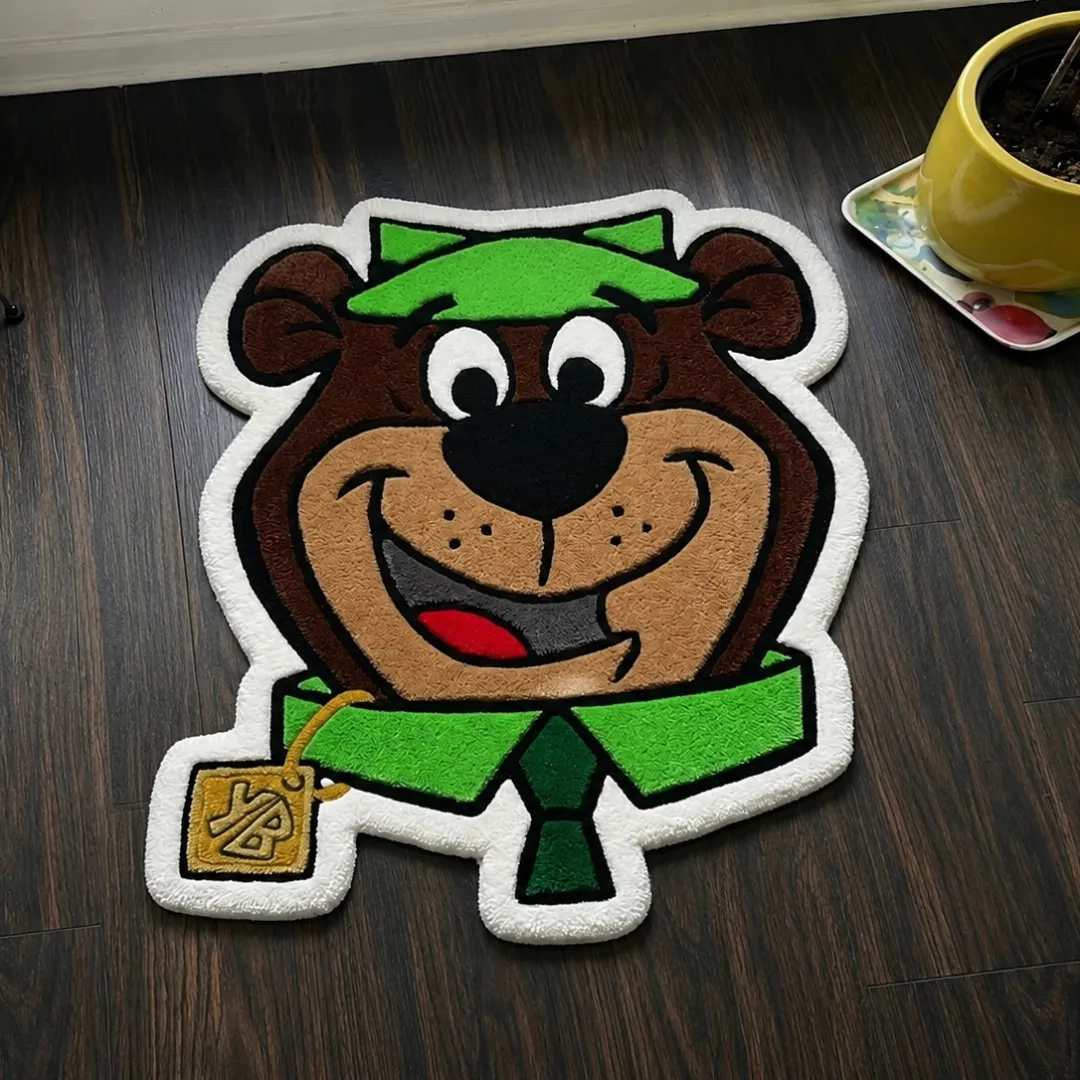 detective snout rug angle view Detective Snout character shaped tufted area rug displayed flat on a dark wooden floor.