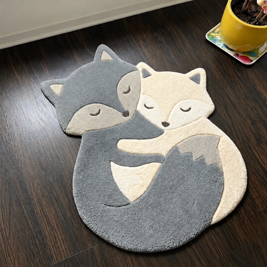 nova cuddle rug angle view Angle view of the handmade Nova Cuddle tufted rug showcasing its unique animal contours and texture.