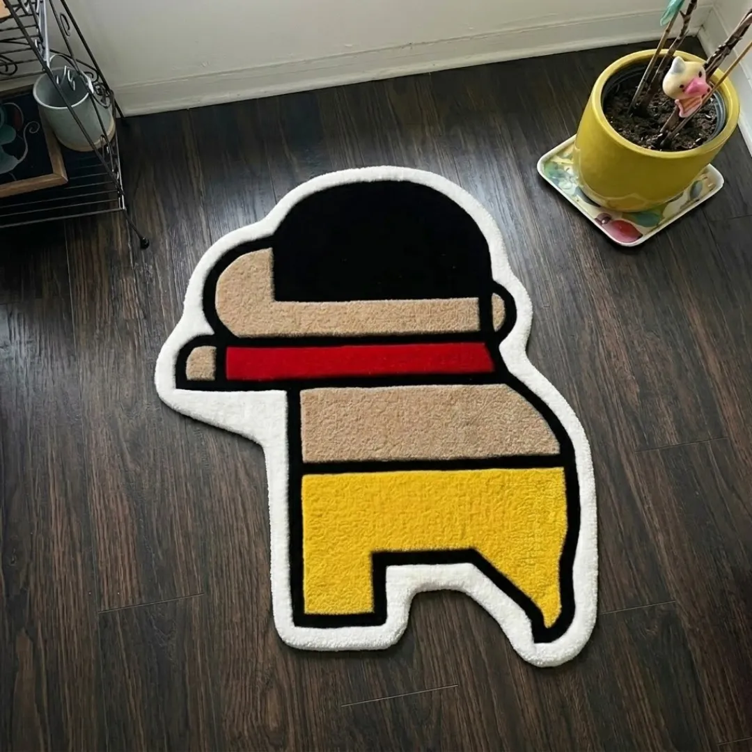 tiny trouble rug top view Tiny Trouble cartoon character shaped tufted area rug displayed flat on a dark wooden floor.