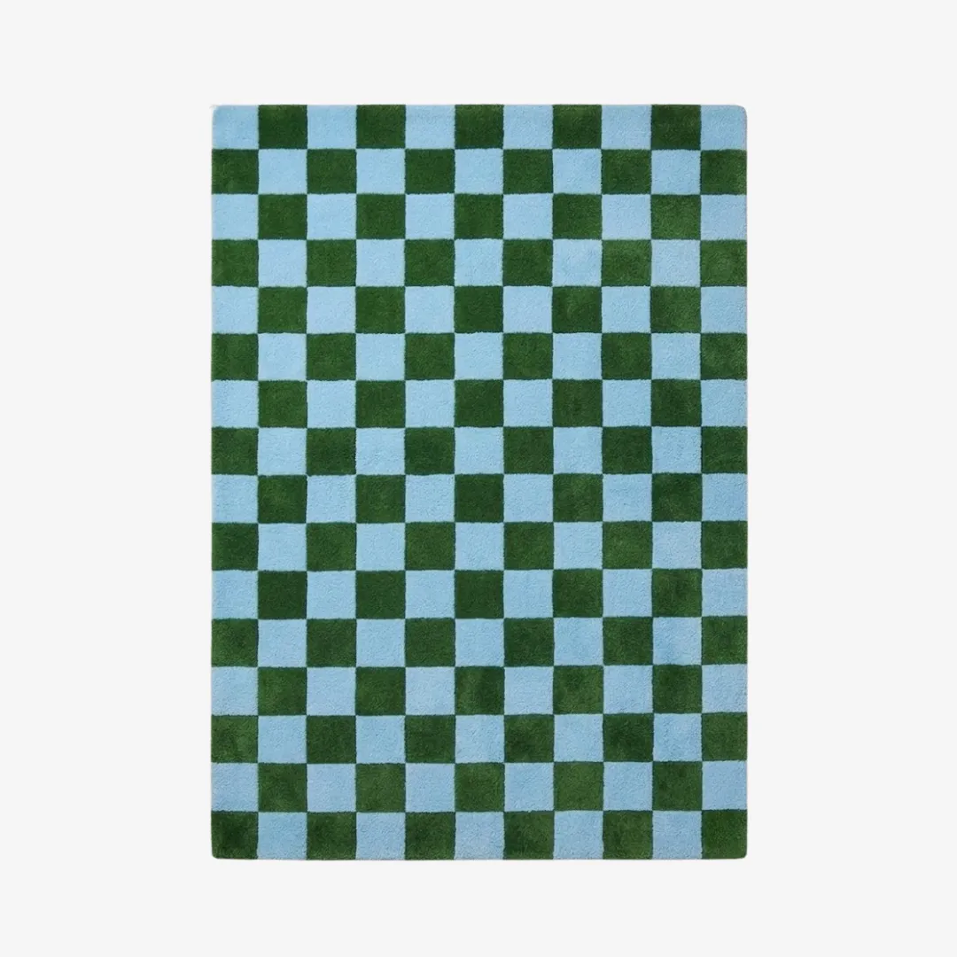 sage check geometric wool area rug product shot A top-down studio product photograph of the rectangular Sage Check area rug, featuring a vibrant, repeating checkerboard pattern in contrasting forest green and sky blue.