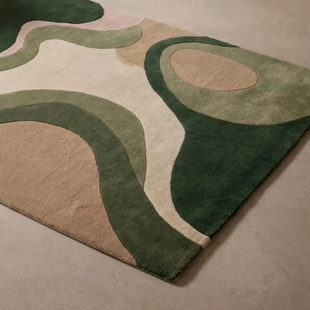 terra drift abstract organic wool area rug texture close up An angled perspective shot of the Terra Drift rug in a contemporary room setting, emphasizing its abstract, wavy contours and earthy color palette against a minimalist background.