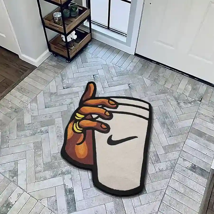 hand holding glass nike swoosh rug