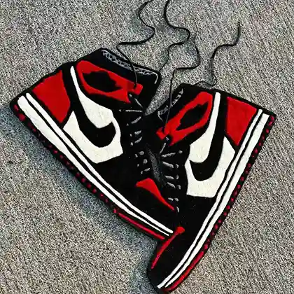 Hanging sneaker rug with black, red, and white colorway
